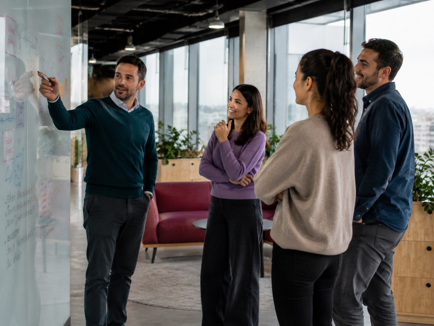 A small team working together at a whiteboard at Supertree, Globalworth BOC Tower, Pipera