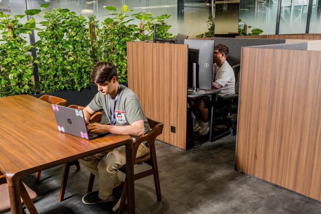 Members working in Modullo mini-offices on the Supertree floor