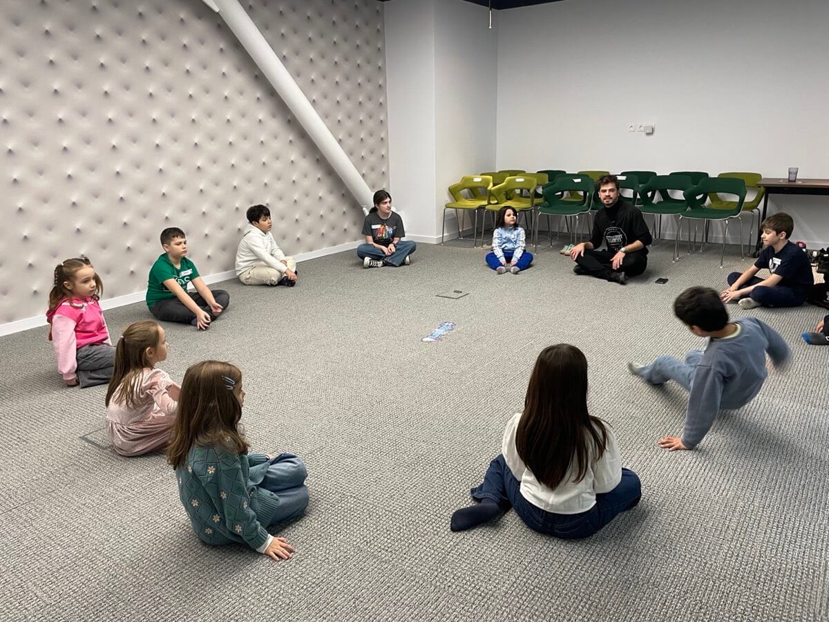 Children in a group activity at Supertree KIDS