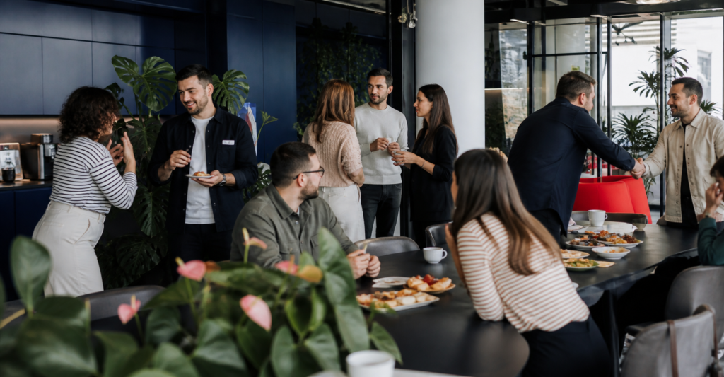 People sharing brunch and conversation in the Supertree coworking space
