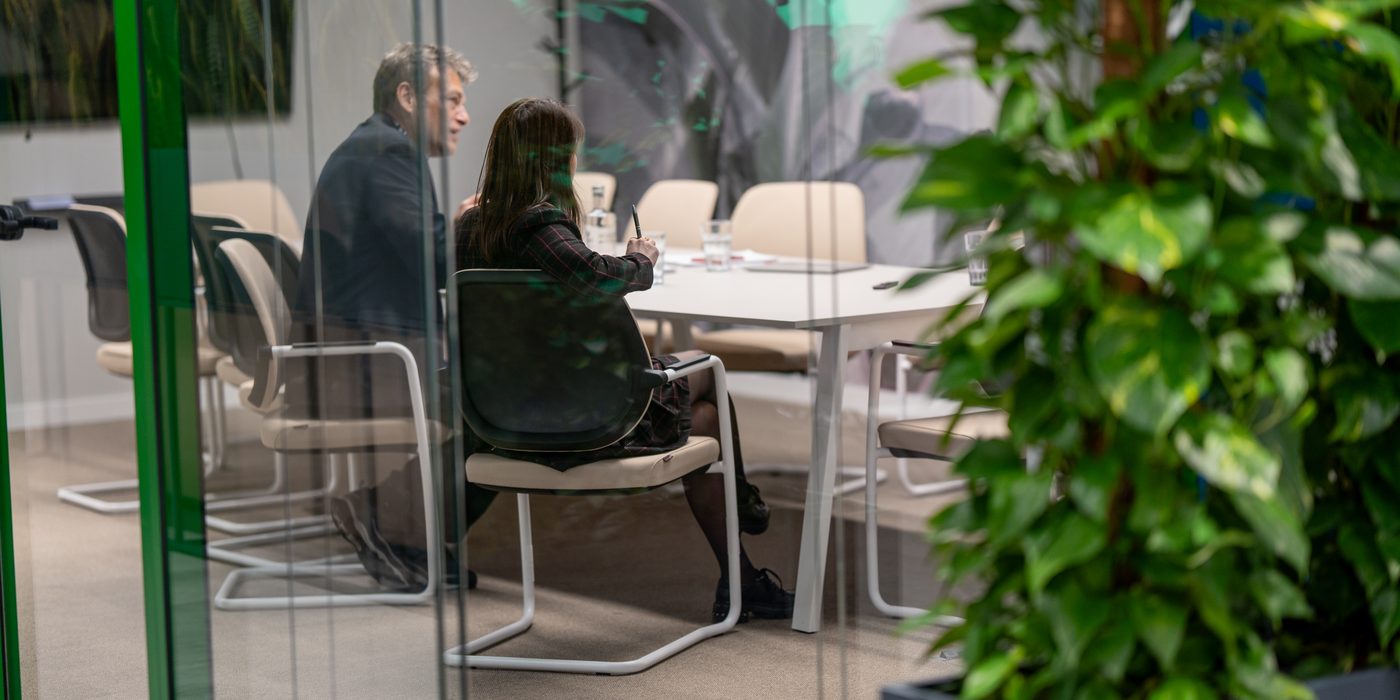 Advisory meeting in a glass meeting room