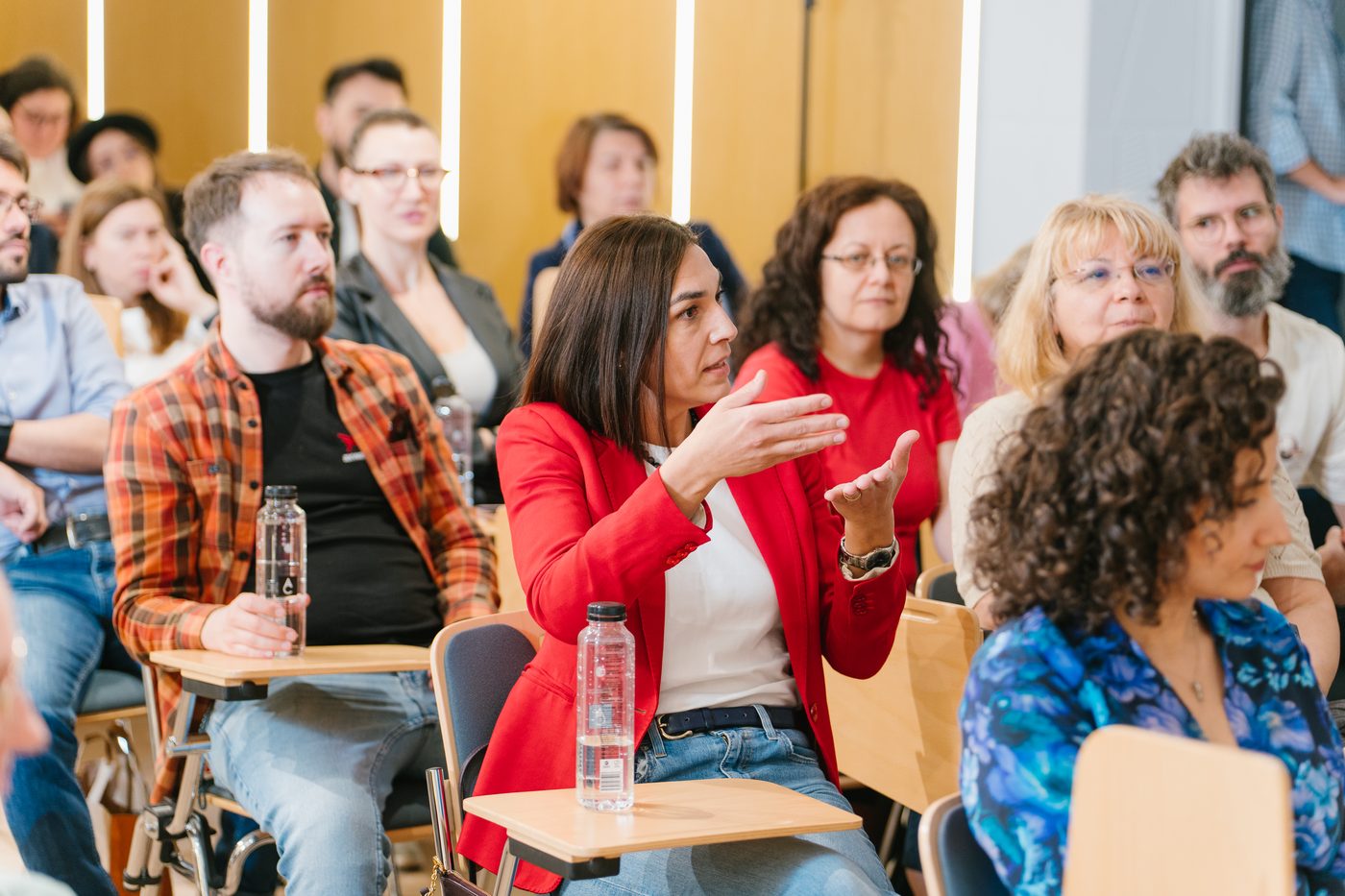 Audience asking questions at a Supertree event
